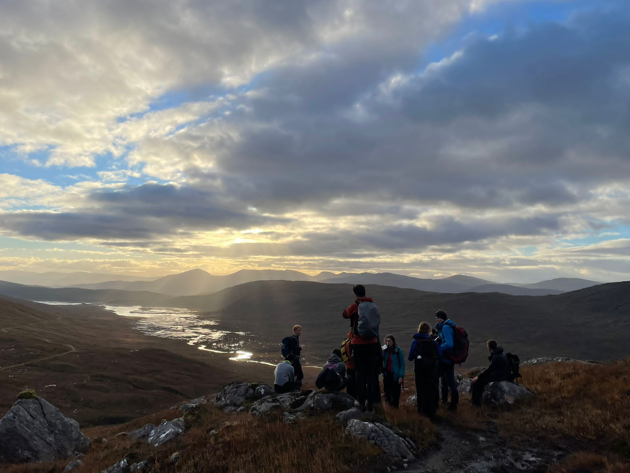 A group of people on a rocky outcrop